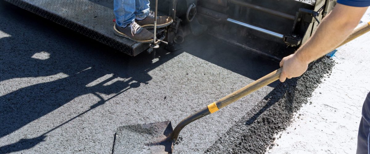 bigstock-Asphalt-Paver-Machine-And-Stea-473837813