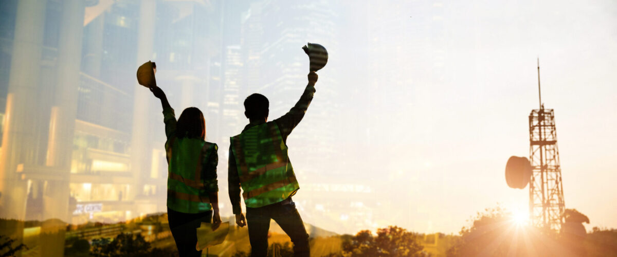 Double exposure image of engineer civil and construction worker with safety helmet and construction drawing against the background of surreal construction site in the night city or dark cityscape.